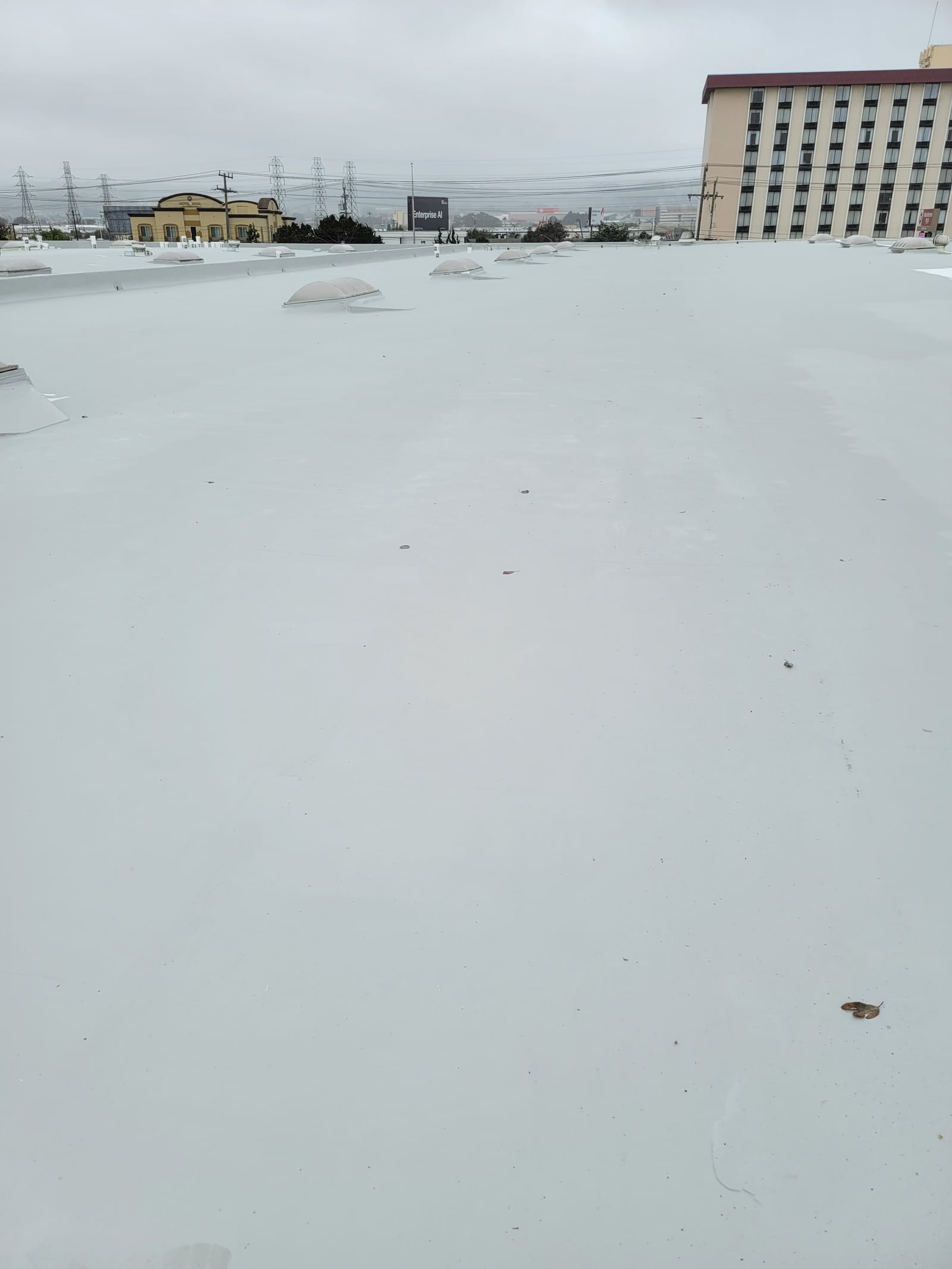 McCurdy Coatings industrial roof project — silicone membrane in progress — Patterson, CA