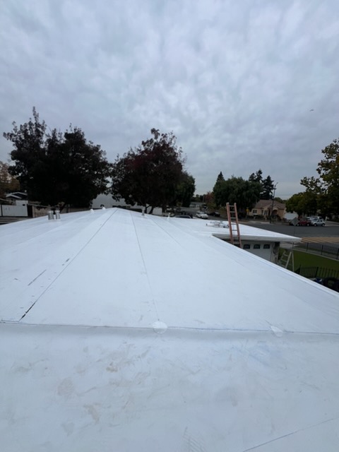 Industrial roofing project — McCurdy Coatings silicone application — Patterson, CA